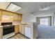 Bright kitchen and open living area with modern appliances and fixtures at 8070 W Russell Rd # 2121, Las Vegas, NV 89113