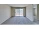 Bright living room with sliding glass doors to a balcony, providing natural light and outdoor access at 8070 W Russell Rd # 2121, Las Vegas, NV 89113