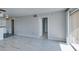 Bright living room with light wood floors, neutral paint, and sliding glass door to balcony at 8070 W Russell Rd # 2121, Las Vegas, NV 89113