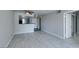 Open living area with modern floors, neutral walls, and a mirrored sliding closet at 8070 W Russell Rd # 2121, Las Vegas, NV 89113
