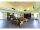 Bright and spacious living room area featuring a fireplace, neutral decor, and comfortable seating at 8070 W Russell Rd # 2121, Las Vegas, NV 89113