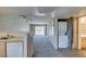 Cozy living area with a ceiling fan, washer, dryer, and access to a balcony at 8070 W Russell Rd # 2121, Las Vegas, NV 89113