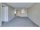 Bright living room with neutral paint, ceiling fan, and partial view of the kitchen area at 8070 W Russell Rd # 2121, Las Vegas, NV 89113