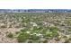A high aerial view of the neighborhood featuring green landscaping, desert, and distant city views at 8134 Maddingley Ave, Las Vegas, NV 89117