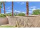 Backyard with palm trees, brick wall, and mountain views at 8134 Maddingley Ave, Las Vegas, NV 89117