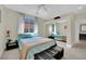 A cozy bedroom with a mirror sliding door closet, carpet, and a comfortable bed with bedside tables at 8134 Maddingley Ave, Las Vegas, NV 89117