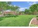Well-maintained community park, featuring green grass, trees and benches at 8134 Maddingley Ave, Las Vegas, NV 89117