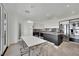 Contemporary dining area features modern table and chairs with a view into the kitchen at 8134 Maddingley Ave, Las Vegas, NV 89117