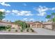 Inviting single-story house featuring a two-car garage, desert landscaping, and an eye-catching vine wall at 8134 Maddingley Ave, Las Vegas, NV 89117