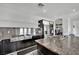 Updated kitchen featuring stainless steel appliances, granite countertops, and sleek cabinetry for a modern culinary experience at 8134 Maddingley Ave, Las Vegas, NV 89117