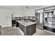 Modern kitchen features stainless steel appliances, granite countertops, and a spacious center island with a sink at 8134 Maddingley Ave, Las Vegas, NV 89117