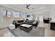 Bright, open living room features a large sectional sofa, area rug, and plenty of natural light at 8134 Maddingley Ave, Las Vegas, NV 89117