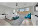 Serene main bedroom with large windows, plush bedding, and stylish decor at 8134 Maddingley Ave, Las Vegas, NV 89117