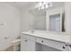 Bright bathroom featuring a single sink vanity, toilet, and a shower-tub combination at 8755 Spanish Ridge Ave, Las Vegas, NV 89148