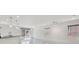 Bright and open living room featuring modern lighting, marble floors, and a sliding glass door at 8755 Spanish Ridge Ave, Las Vegas, NV 89148