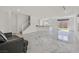 Spacious living room with marble floors, a staircase, and ample natural light at 8755 Spanish Ridge Ave, Las Vegas, NV 89148