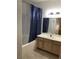 Bathroom with a tub and oak cabinets at 9000 Las Vegas Blvd # 2033, Las Vegas, NV 89123