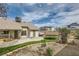 A well maintained backyard is landscaped with synthetic turf, hardscape, and perimeter fencing at 901 Clipper Dr, Henderson, NV 89015
