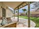 Enjoy the shade on this covered patio, with a view to the backyard with a manicured lawn at 901 Clipper Dr, Henderson, NV 89015