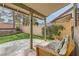Relax outdoors on this covered patio overlooking a verdant backyard with block wall and some landscaping at 901 Clipper Dr, Henderson, NV 89015