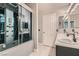 Bathroom with a modern shower, dual sinks, and tile floors at 901 Clipper Dr, Henderson, NV 89015