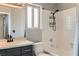 This full bathroom features a shower-tub combo and a dark vanity with light countertops at 901 Clipper Dr, Henderson, NV 89015