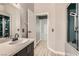 Bathroom featuring a vanity with stone countertops and modern shower at 901 Clipper Dr, Henderson, NV 89015