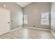 Bedroom featuring gray walls, tile flooring, and natural light from the windows at 901 Clipper Dr, Henderson, NV 89015