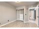 This cozy bedroom features wood-look flooring and a built in closet and drawer unit for tidy storage at 901 Clipper Dr, Henderson, NV 89015