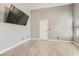 Bedroom featuring light-gray walls, wood-look flooring, and natural light at 901 Clipper Dr, Henderson, NV 89015