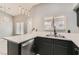 Bright kitchen showcasing stone countertops, updated appliances, and a stainless steel sink at 901 Clipper Dr, Henderson, NV 89015