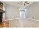 Bright living room featuring modern light-gray walls, flooring, and fireplace at 901 Clipper Dr, Henderson, NV 89015