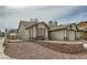 Side view of home showing the yard, neutral siding, and the attached garage at 901 Clipper Dr, Henderson, NV 89015