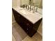 Bathroom vanity with a modern sink and a granite countertop at 9133 Forest Willow Ave # 102, Las Vegas, NV 89149