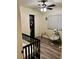 Cozy bedroom featuring a ceiling fan, laminate wood floors, and a closet at 9133 Forest Willow Ave # 102, Las Vegas, NV 89149