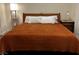 Cozy bedroom featuring a comfortable bed with a striking, solid-colored quilt and soft, inviting pillows at 9133 Forest Willow Ave # 102, Las Vegas, NV 89149