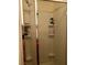 Modern glass-enclosed shower with built-in shelves for toiletries and cleaning essentials at 9133 Forest Willow Ave # 102, Las Vegas, NV 89149