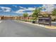 The community entrance has signage that reads 'Highfield at Windham' and a wrought iron gate at 9638 Smiley Creek St, Las Vegas, NV 89178