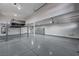 This garage is clean and has car lift, epoxy flooring, and garage storage cabinets at 9638 Smiley Creek St, Las Vegas, NV 89178