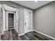 Hallway with contemporary white doors, gray walls, and modern wood-look floors at 9638 Smiley Creek St, Las Vegas, NV 89178