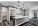 Modern kitchen with a large island, stainless steel appliances, and pantry at 9638 Smiley Creek St, Las Vegas, NV 89178
