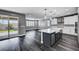 Open-concept kitchen and living area with wood floors and backyard access at 9638 Smiley Creek St, Las Vegas, NV 89178