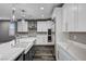Bright kitchen featuring quartz countertops, stainless appliances, and modern lighting at 9638 Smiley Creek St, Las Vegas, NV 89178