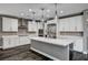 Modern kitchen with white cabinets, stainless appliances, and a center island at 9638 Smiley Creek St, Las Vegas, NV 89178
