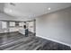Open living area featuring gray walls, and a view of the kitchen and back yard at 9638 Smiley Creek St, Las Vegas, NV 89178
