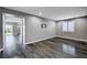 Open living area featuring wood flooring, recessed lighting, and a view of the backyard at 9638 Smiley Creek St, Las Vegas, NV 89178