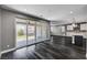 Living room with sliding glass doors leading to the backyard and connected to the kitchen at 9638 Smiley Creek St, Las Vegas, NV 89178