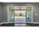 Living space with sliding glass doors leading to a backyard with a patio and lawn at 9638 Smiley Creek St, Las Vegas, NV 89178