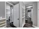 Large walk-in closet with custom shelving and wood-look flooring at 9638 Smiley Creek St, Las Vegas, NV 89178