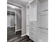 Walk-in closet with custom storage system and rod for ample storage at 9638 Smiley Creek St, Las Vegas, NV 89178